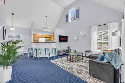 a living room with a couch and a table at Family Resort Condo Disney 5 miles in Kissimmee
