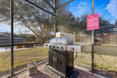 a grill in front of a building with a sign at 3179 Yellow Lantana Lane in Kissimmee