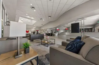 an office lobby with a couch and a table at 3179 Yellow Lantana Lane in Kissimmee