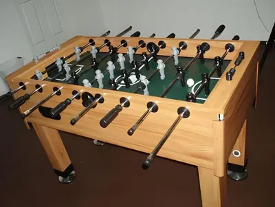 a wooden chess board with a table with a chess at Private Pool with spa and Game Room Near Disney in Kissimmee
