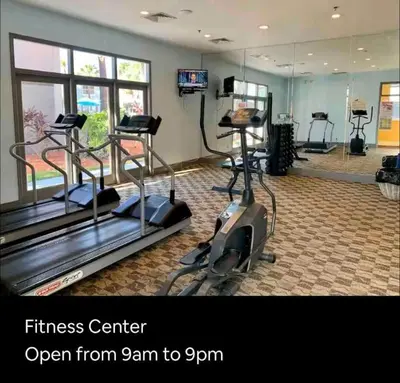 a fitness center with treadmills and a gym at Condo Epic Universal Disney Free Parking in Orlando