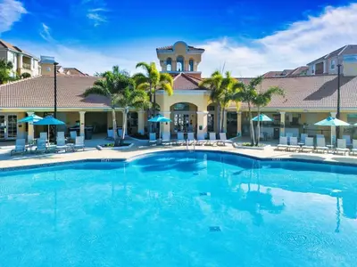 a large swimming pool in front of a hotel at Vista Cay Resort Near Parks Convention Center in Orlando