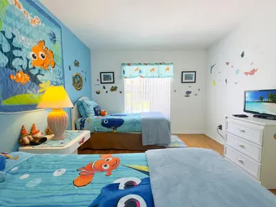 a bedroom with two beds and a fish mural at Minutes from Disney Themed 2 Bd Villa with Private Pool home in Orlando