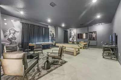 a room with a pool table and ping pong tables at Paradiso’s Luxurious New Home w 15 Ensuites in Orlando