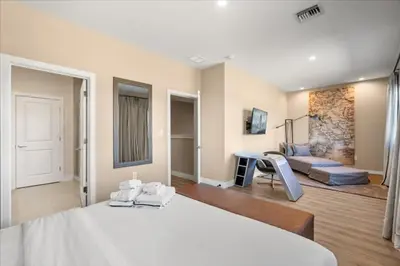 a bedroom with a bed and a living room at 5565Torino in Kissimmee