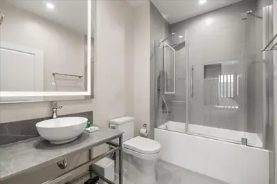 a bathroom with a sink and a toilet and a shower at 5565Torino in Kissimmee