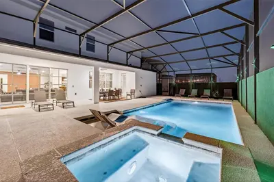 an indoor swimming pool with a glass ceiling at Resort-Style Living w Private Pool & Amenities in Kissimmee