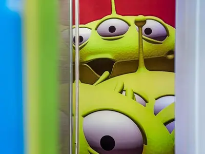 a cartoon frog is sitting in a locker at Toy Story Magic Studio Close to Disney in Kissimmee