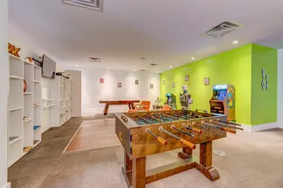a room with a large table with guns in it at Toy Story Magic Studio Close to Disney in Kissimmee