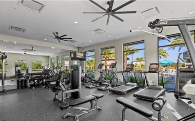 a gym with several treadmills and cardio equipment at 2026 NEW 12Bedrooms12Bathroom At Paradiso Grande in Orlando