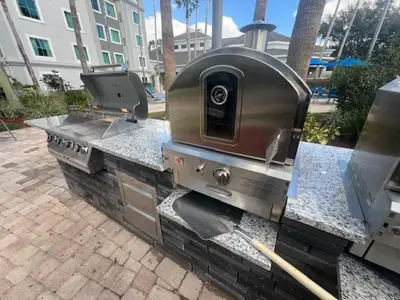 a grill sitting on top of a stone counter at Free Shuttle Mickey Universal Epic SeaWorld in Orlando