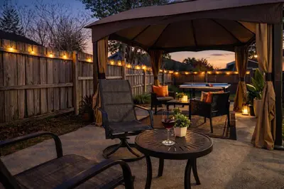 a patio with a gazebo and a table and chairs at Family Retreat - 9 Min from Disney in Kissimmee