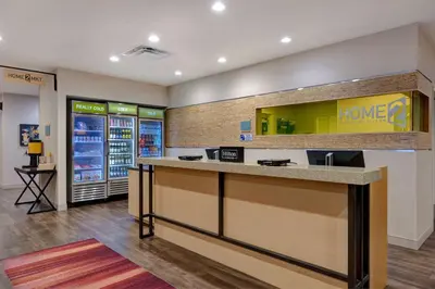 a lobby of a home store with a counter at Home2 Suites by Hilton Orlando International Drive South - Free Shuttle to Theme Parks in Orlando