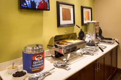 a kitchen counter with a buffet at Staybridge Suites Orlando at SeaWorld by IHG - Free Breakfast & Shuttle to SeaWorld Parks in Orlando