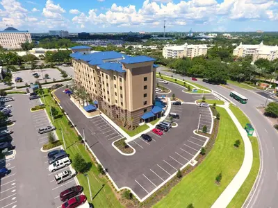 an aerial view of a building with a parking lot at Staybridge Suites Orlando at SeaWorld by IHG - Free Breakfast & Shuttle to SeaWorld Parks in Orlando