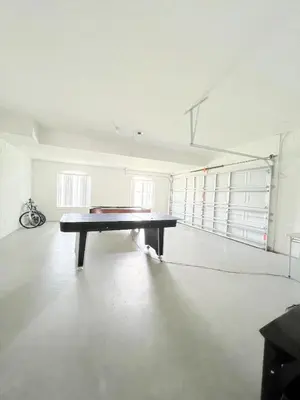 an empty room with a ping pong table in it at Clermont Vacation Homes by DWS Vacation in Orlando