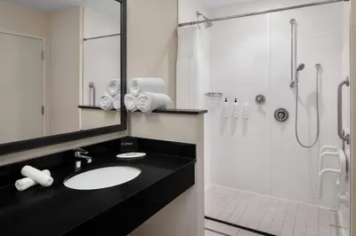 a bathroom with a sink and a shower at Fairfield Inn & Suites by Marriott Orlando Kissimmee/Celebration in Orlando