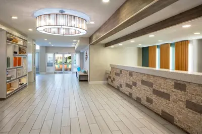 a lobby of a hospital with a stone wall at Residence Inn Orlando Convention Center in Orlando