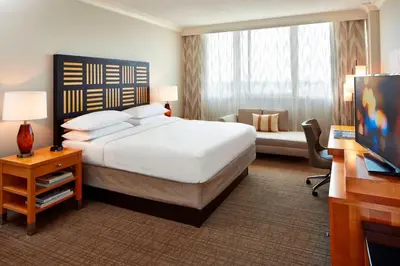 a hotel room with a large bed and a window at Renaissance Orlando Airport Hotel in Orlando