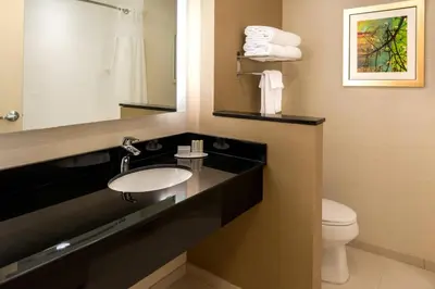 a bathroom with a sink and a toilet at Fairfield Inn & Suites by Marriott Orlando East/UCF Area in Orlando