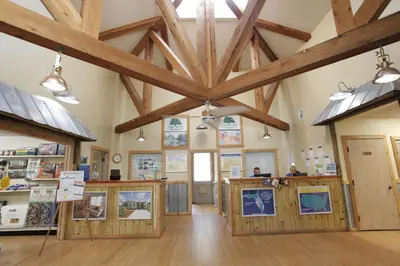 a large room with wooden ceilings and wooden beams at Sherwood Forest Cottage 6 in Kissimmee