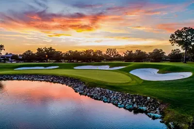 a view of a golf course with a pond at Arnold Palmer's Bay Hill Club & Lodge in Orlando