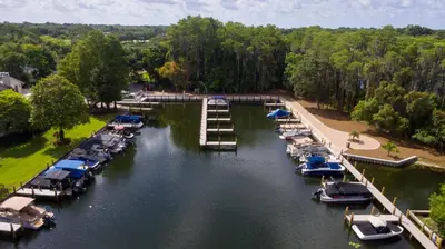 an aerial view of a marina with boats in the water at Arnold Palmer's Bay Hill Club & Lodge in Orlando