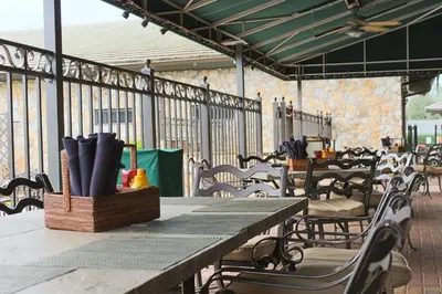 a table and chairs on a patio at Arnold Palmer's Bay Hill Club & Lodge in Orlando