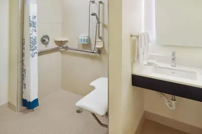 a bathroom with a sink and a toilet at Residence Inn by Marriott Orlando at SeaWorld in Orlando