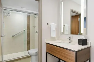 a bathroom with a sink and a toilet and a shower at Hyatt Place Orlando / I-Drive / Convention Center in Orlando