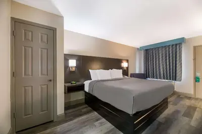 a hotel room with a bed and a window at Quality Inn & Suites Altamonte Springs Orlando-North in Orlando