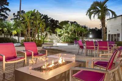 a group of chairs sitting around a table with candles at Crowne Plaza Orlando - Lake Buena Vista by IHG in Orlando
