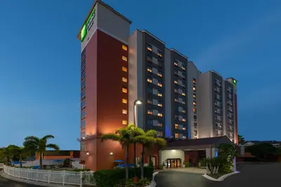 a rendering of a hotel at night at Holiday Inn Express & Suites - Nearest Universal Orlando by IHG in Orlando