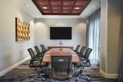a conference room with a large table and chairs at Fairfield Inn & Suites by Marriott Orlando International Drive/Convention Center in Orlando