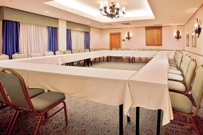 a conference room with a long table and chairs at Best Western Plus Orlando Lake Buena Vista South Inn & Suites in Kissimmee