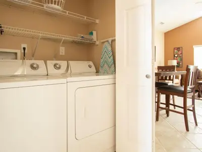 a laundry room with a washer and dryer at 3 Bed 258 in Kissimmee