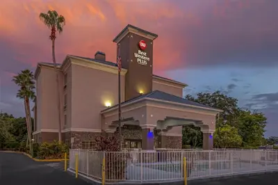 a building with a clock tower on top of it at Best Western Plus Sanford Airport/Lake Mary Hotel in Sanford