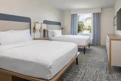 a hotel room with two beds and a window at Homewood Suites by Hilton Lake Buena Vista Orlando - Newly Renovated! in Orlando