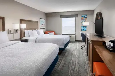 a hotel room with two beds and a television at Hampton Inn & Suites at Lake Mary Colonial Townpark in Lake Mary