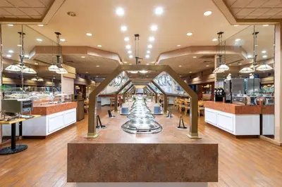 a restaurant with a trophy in the middle of a room at Ramada by Wyndham Kissimmee Gateway - Free Theme Park Shuttle in Orlando