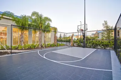a basketball court in a building with a basketball hoop at Homewood Suites by Hilton Orlando Theme Parks in Orlando