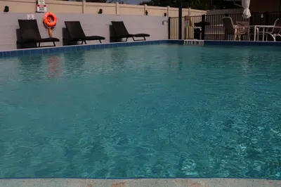 a large pool of water with chairs in it at Magic Key - Near Disney in Kissimmee