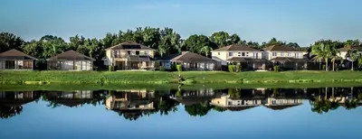 a group of houses next to a body of water at Suaimhneas in Kissimmee