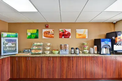 a counter with food and drinks on top of it at Quality Inn & Suites Heritage Park in Kissimmee