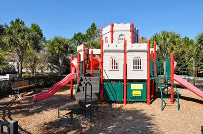 a playground with a slide in a park at Windsor Hills Resort 2 Miles to Disney 6-Bedroom 4-Bathrooms Villa with Private Pool and Spa in Orlando
