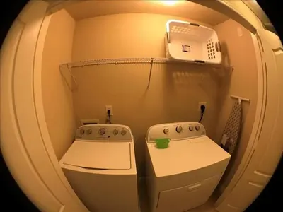 a small room with a sink and a microwave at Four Bedrooms Townhome 5126 in Kissimmee