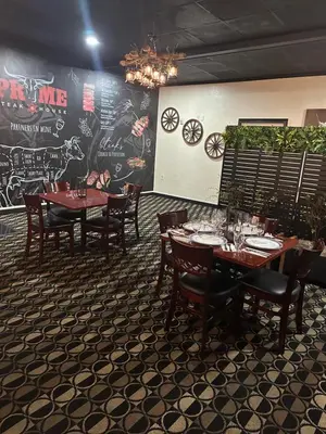 a dining room with tables and chairs and a wall with graffiti at Days Inn by Wyndham Orlando Airport Florida Mall in Orlando