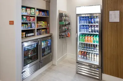 a refrigerator in a store with lots of drinks at TownePlace Suites by Marriott Orlando at SeaWorld in Orlando