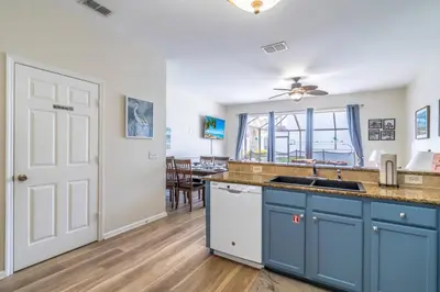 a kitchen with blue cabinets and a sink at 2582 Windsor Hills in Orlando