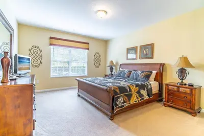 a bedroom with a bed and a television in it at Viz Cay 4816 in Orlando